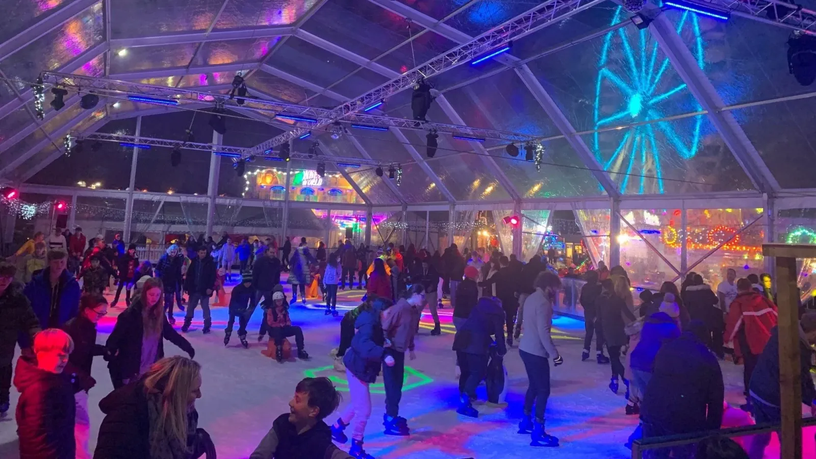 Skaters on the covered rink under the clear dome at Reading Winter Wonderland (the operator's photo) — Reading Winter Wonderland