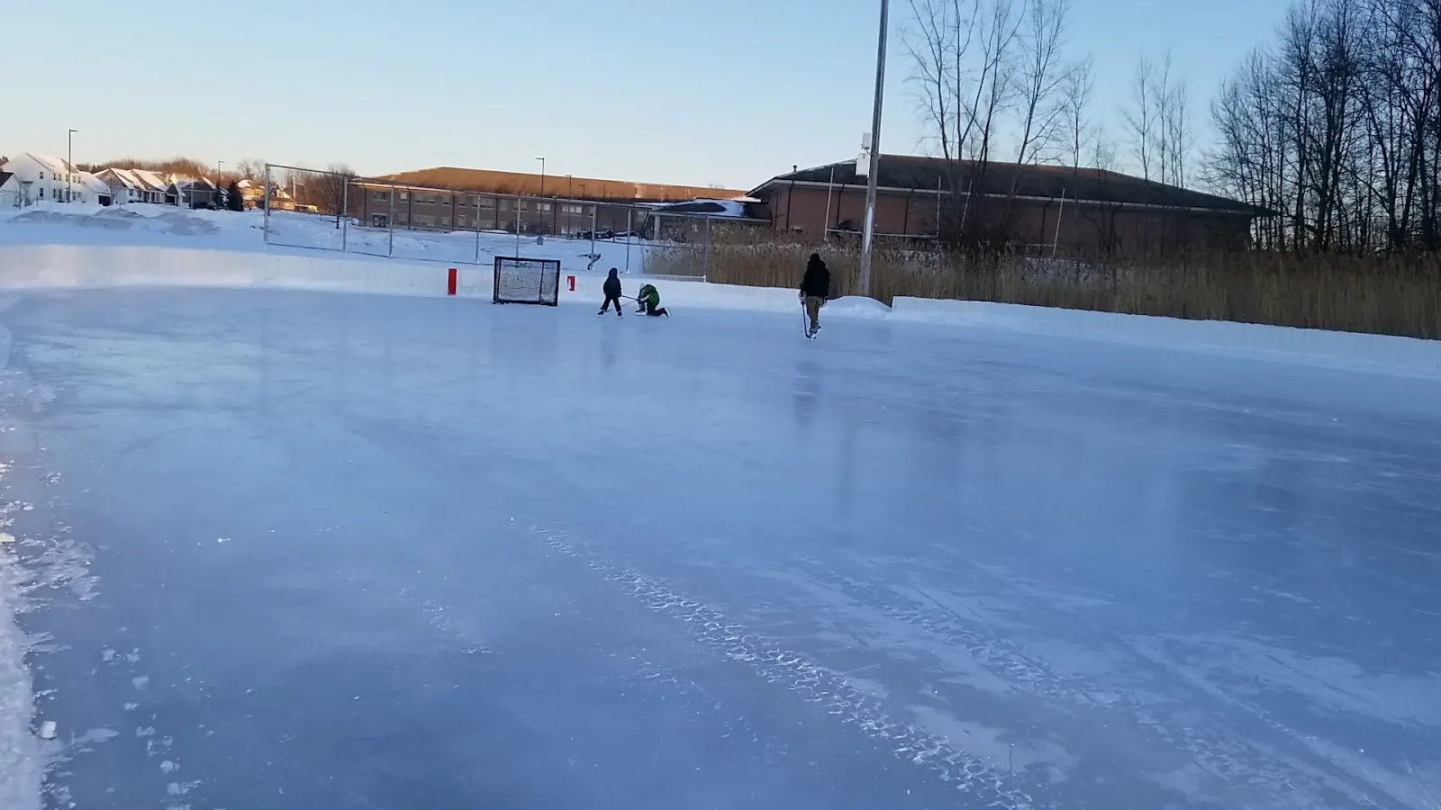 Skaters on the frozen rink at Red Smith Park, Green Bay (Google Maps listing photo) — Red Smith Park Outdoor Rink
