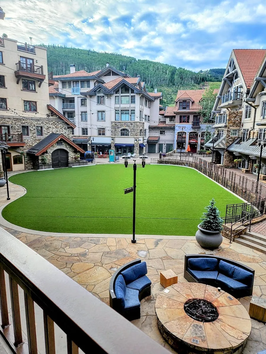 Reflection Plaza in Mountain Village in summer, the lawn-covered plaza where the ice rink is set up for winter — Reflection Plaza Ice Rink (Mountain Village)