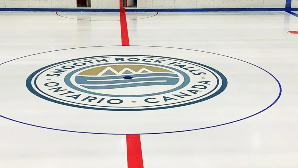 Center ice with the Smooth Rock Falls crest at the Reg Lamy Cultural Centre arena — Reg Lamy Cultural Centre