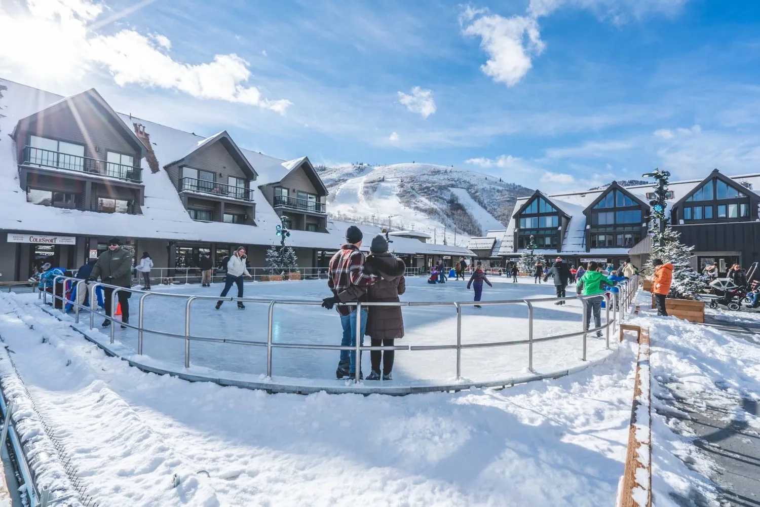 The Resort Center rink with snow and the ski base buildings — Resort Center Ice Rink