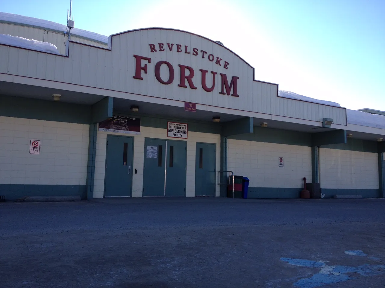 The Revelstoke Forum arena building with its sign on Vernon Avenue — Revelstoke Forum