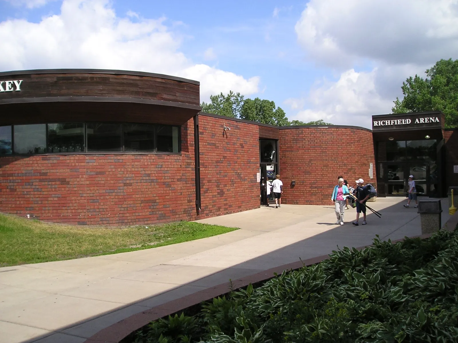 Front entrance of Richfield Ice Arena, a brick building with "RICHFIELD ARENA" lettering above the doors. — Richfield Ice Arena