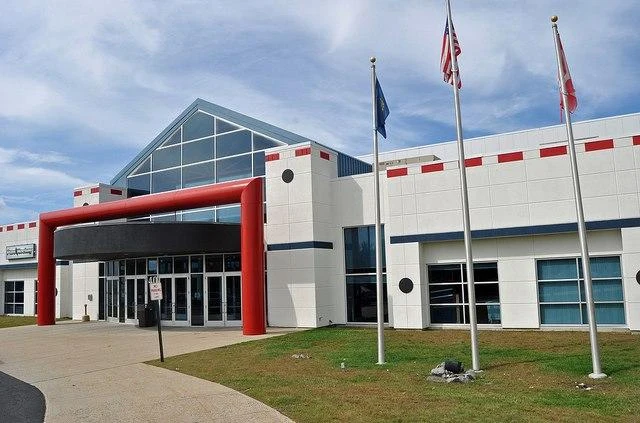 The Rinks at Exeter’s main entrance, with its glass gable and red entrance frame. — The Rinks at Exeter