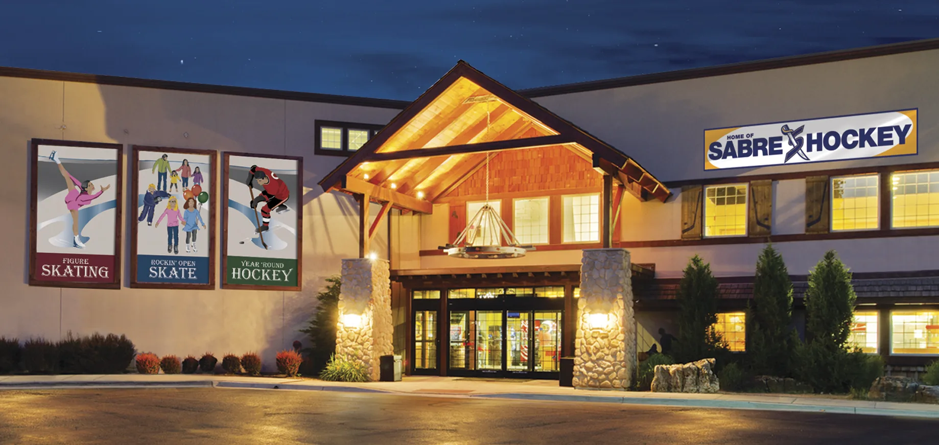 Timber-framed entrance lit at dusk, skating panels in the windows — Rocket Ice Skating Rink (Bolingbrook)