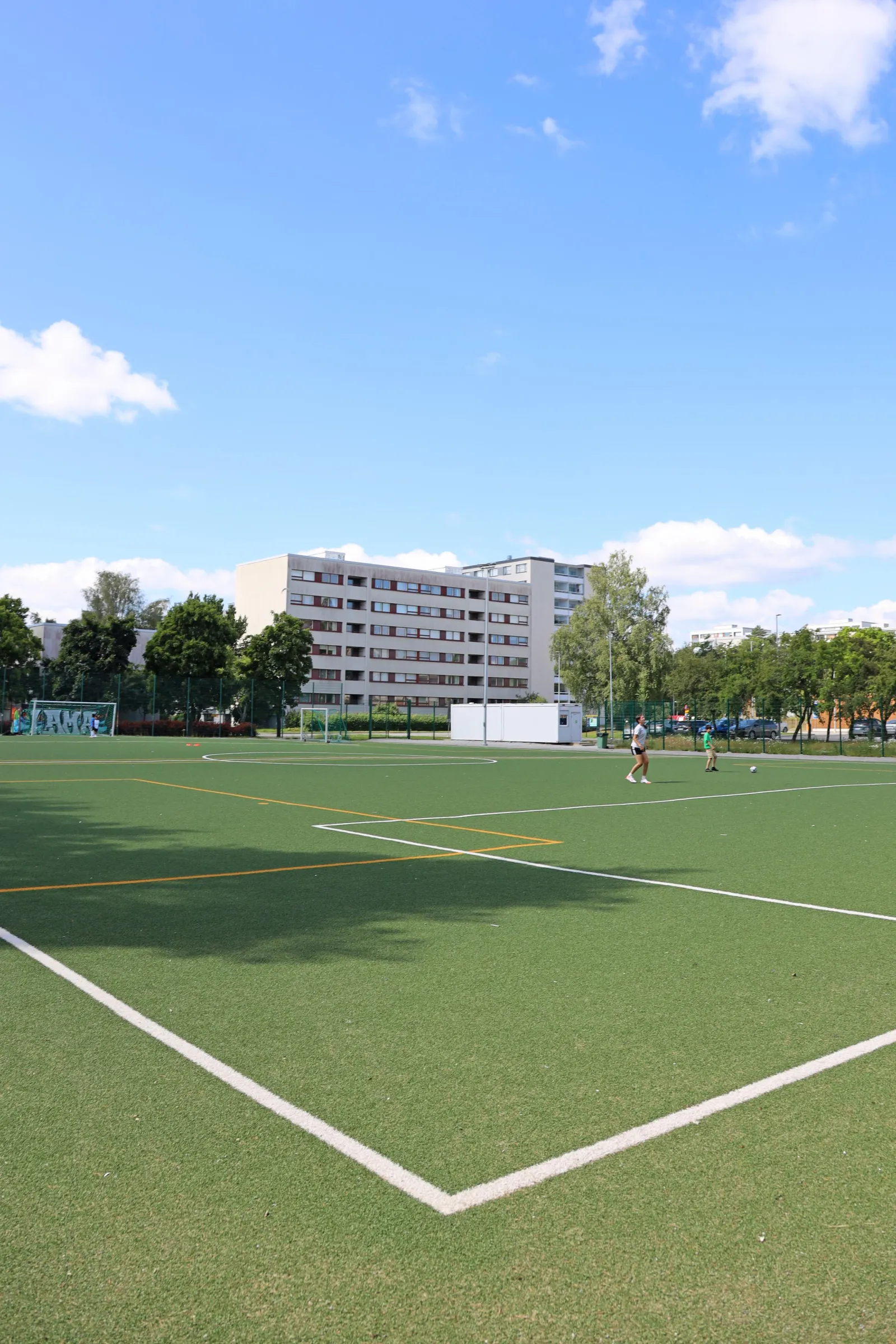 The Runosmäen field in summer, an artificial-turf pitch with goals; the City of Turku freezes its fields into skating fields in winter. — Runosmäen luistelukenttä