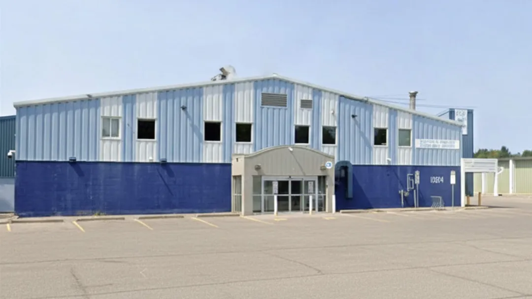 The two-tone blue front of the Russell Arena with its glass entrance and the 1084 street number. — Frank Kinnaird Russell Arena