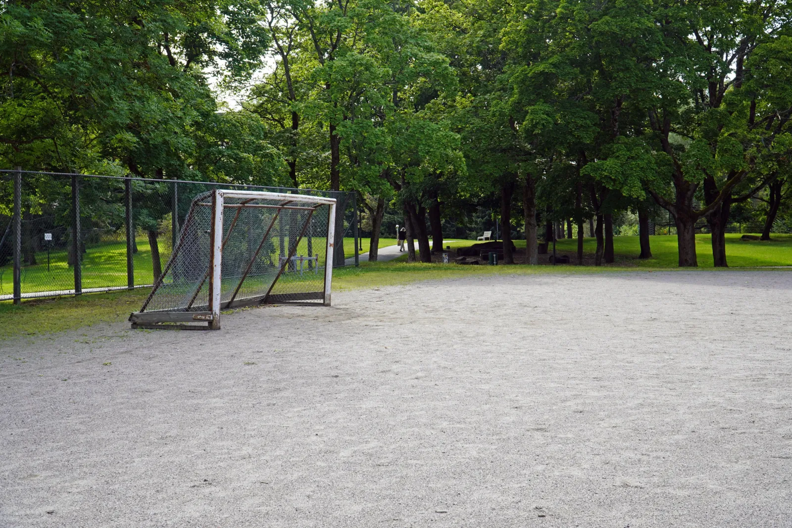 The Samppalinna field in summer, a ball field with a gravel (stone-dust) surface with goals; the City of Turku freezes its fields into skating fields in winter. — Samppalinna luistelukenttä