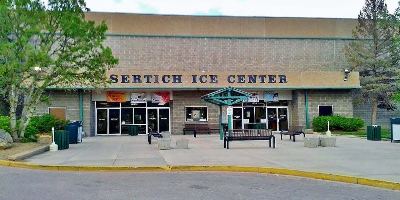 Sertich Ice Center’s entrance in 2013, with its lettered sign above the doors and benches on the front plaza. — Sertich Ice Center