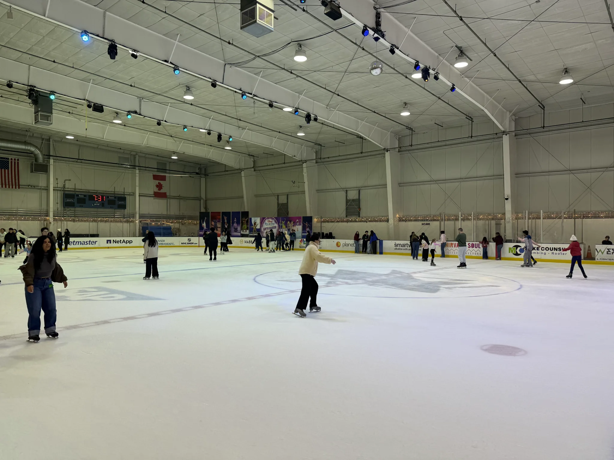 Busy public skating session filling one of the sheets — Sharks Ice at San Jose