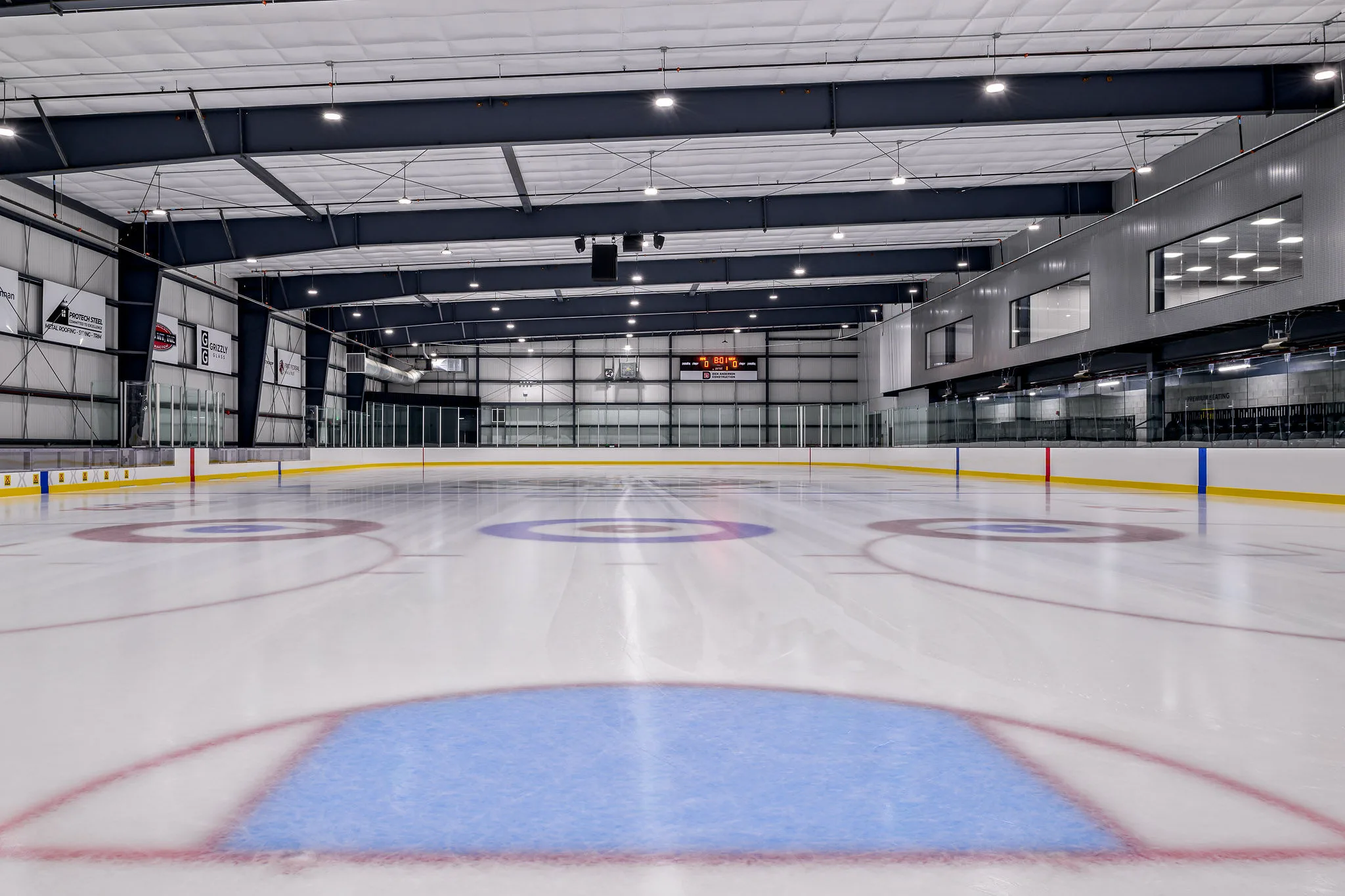 Empty sheet at Signal Peak Energy Arena shot from ice level at one end — Signal Peak Energy Ice Arena