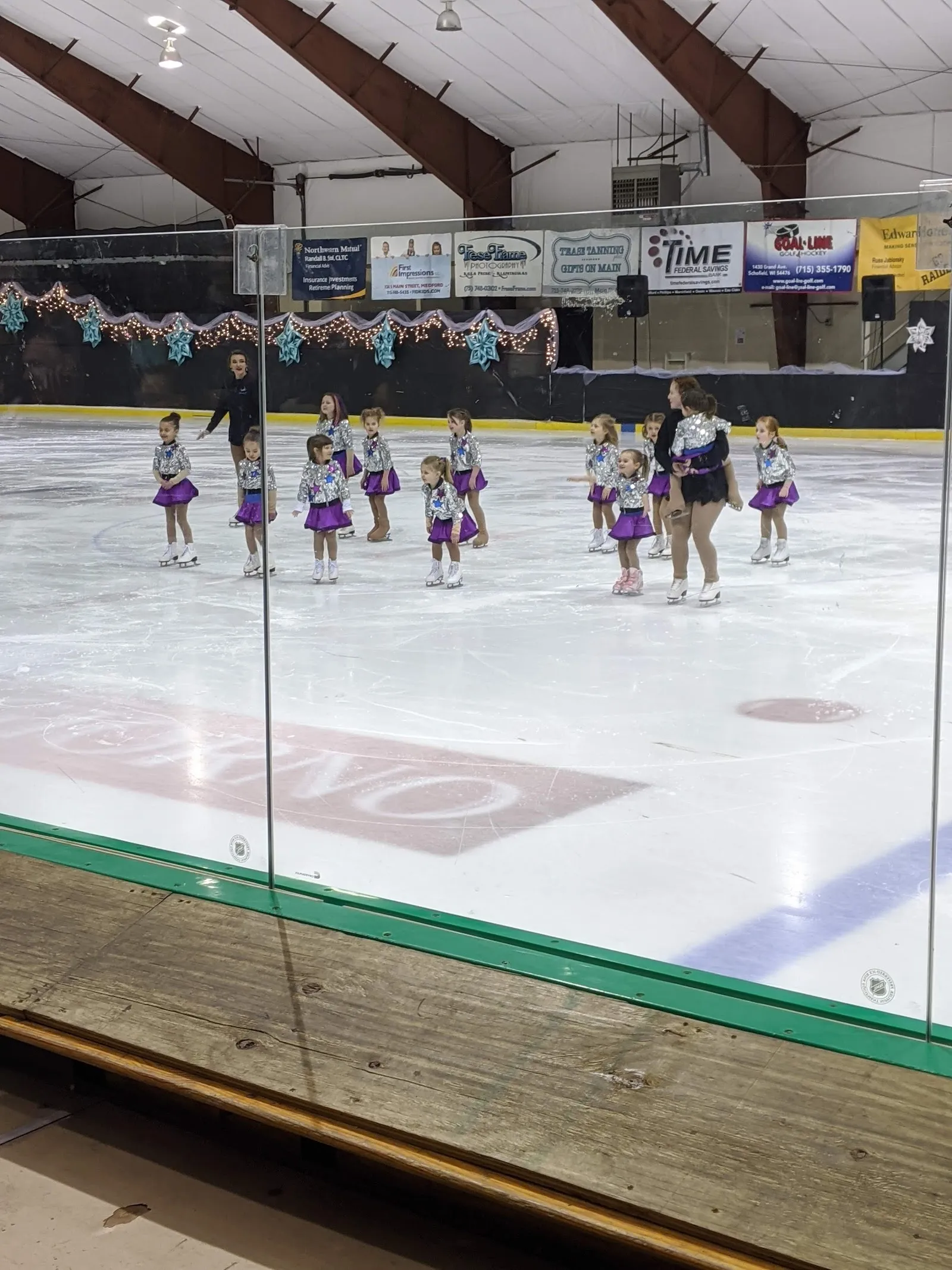 Young figure skaters on the ice at the Simek Recreation Center, seen through the rink glass (photo from the Google Maps listing) — Simek Recreation Center