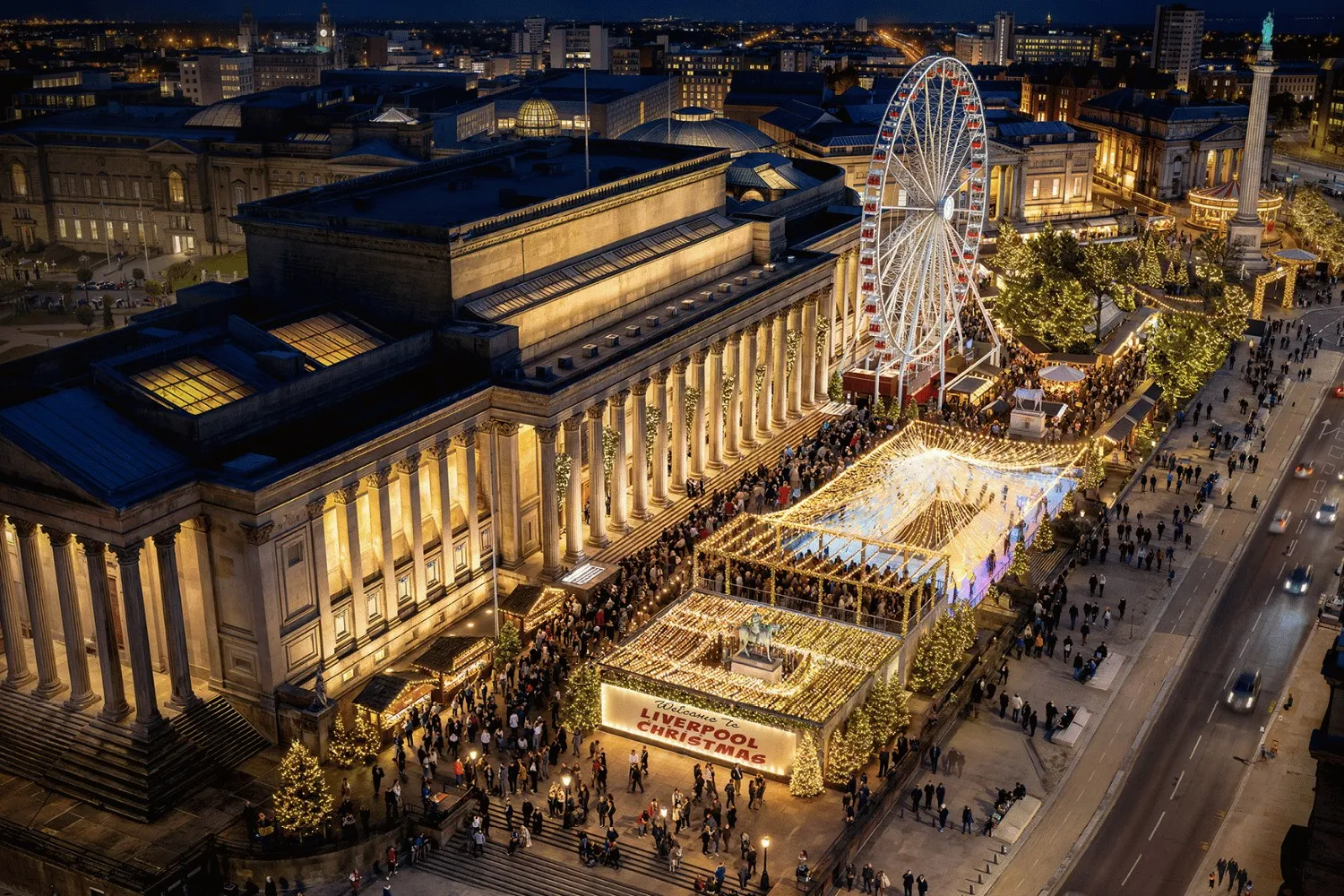 Aerial view at night of St George's Hall in Liverpool with the Skate rink and Christmas market on the plateau beside it — Skate St George's