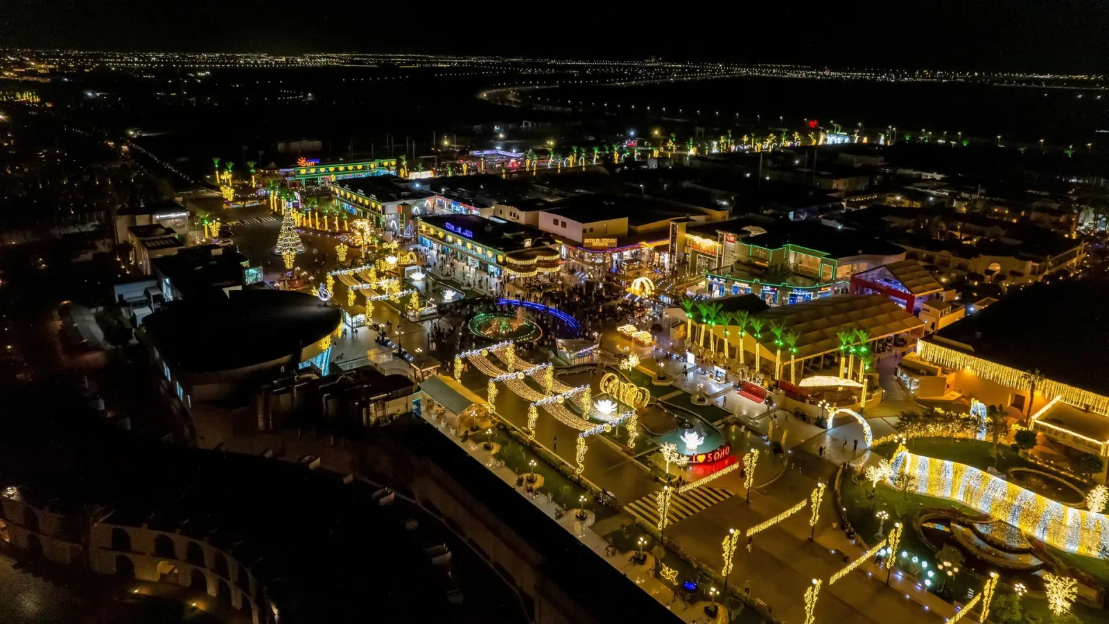 SOHO Square, the Sharm El Sheikh entertainment complex that houses the ice rink, seen from the air at night with its festive lights. — Ice Rink at SOHO Square