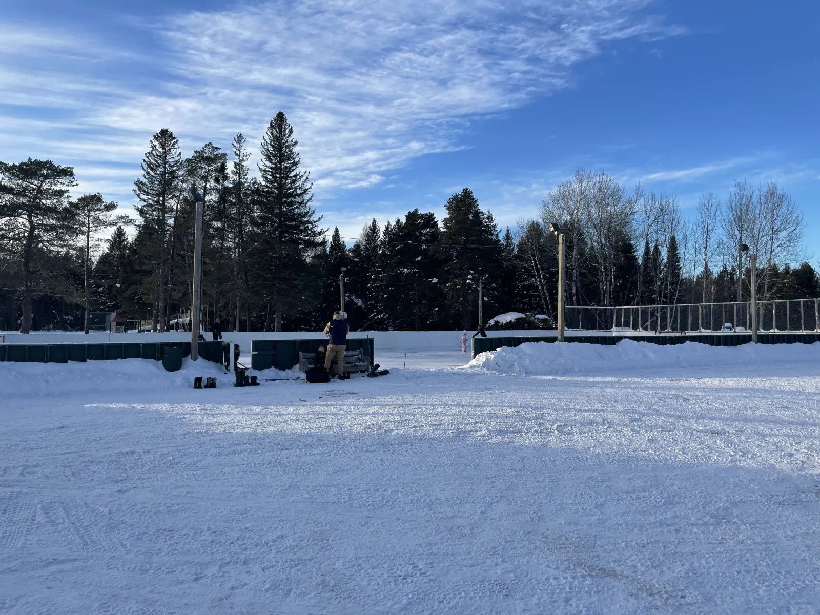 The boarded rink at South Neebing Community Centre with snow on the ice — South Neebing Community Centre Outdoor Rink