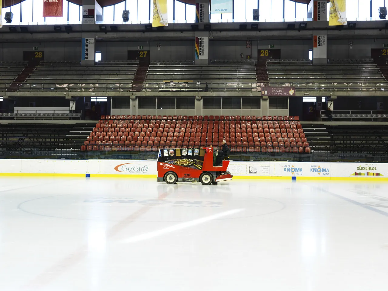 The ice of the Sparkasse Arena with the ice resurfacer and the stands behind the boards. — Sparkasse Arena (Palaonda)