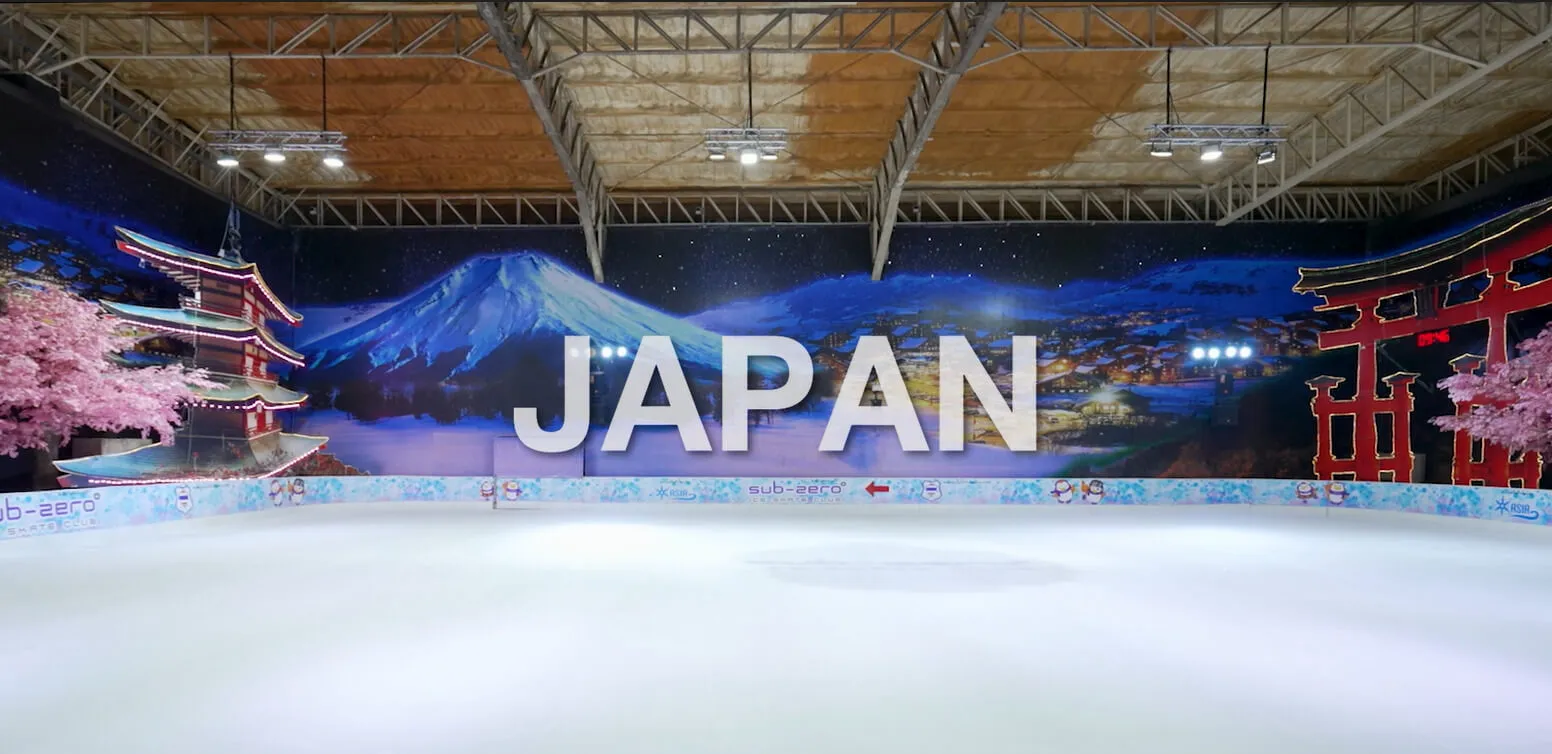 The empty Arena Rink at Sukhumvit-Ekkamai under its Japan-themed painted backdrop, with Mount Fuji and a pagoda behind the boards. — Sub-Zero Ice Skate Club Sukhumvit-Ekkamai