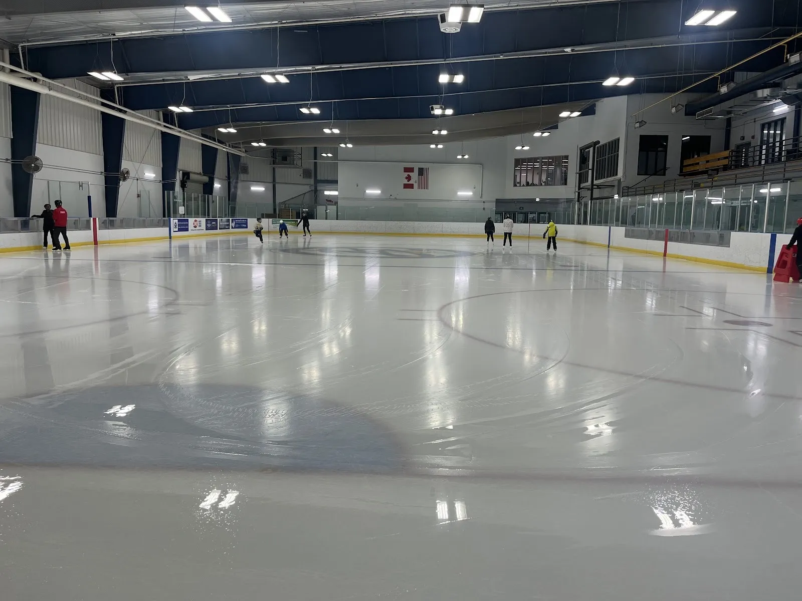 A quiet public skate on one of the pads at the Susan Fennell Sportsplex in Brampton, under blue roof beams — Susan Fennell Sportsplex (South Fletcher's)