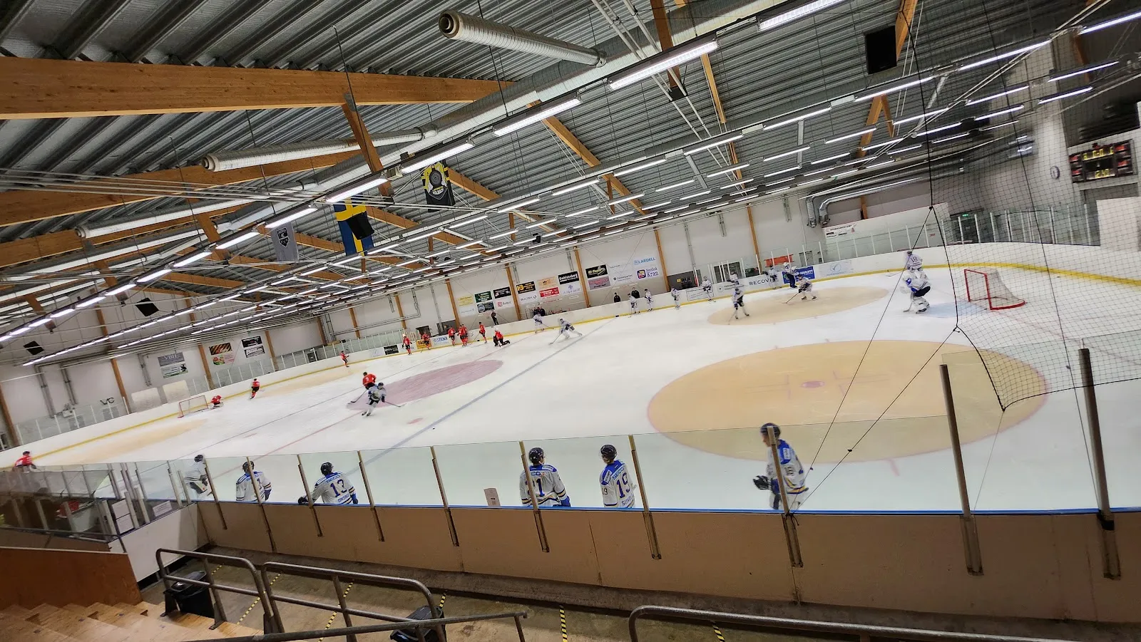 Players on the ice in the Swetex Arena in Hallstahammar, seen from the stands — Swetex Arena