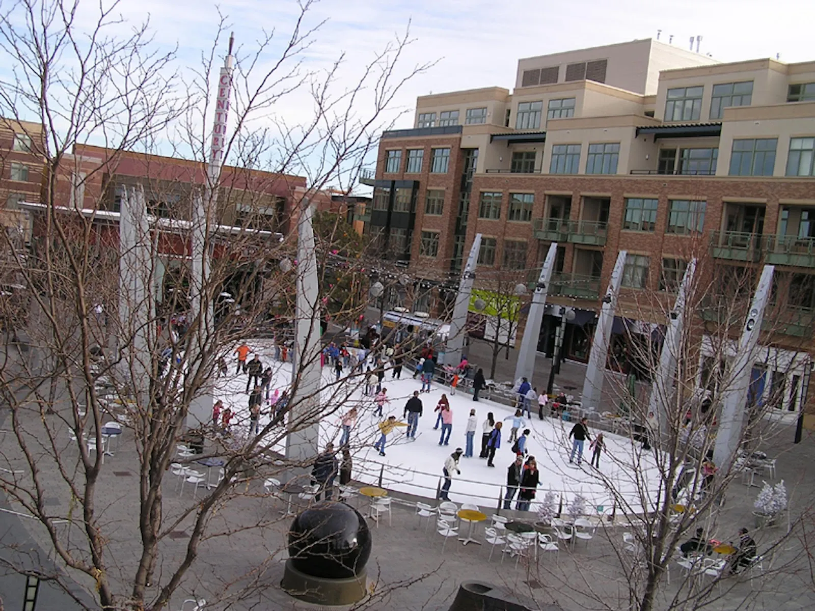 The Rink at Belmar seen from above, a plaza rink among the shops and apartment buildings — The Rink at Belmar