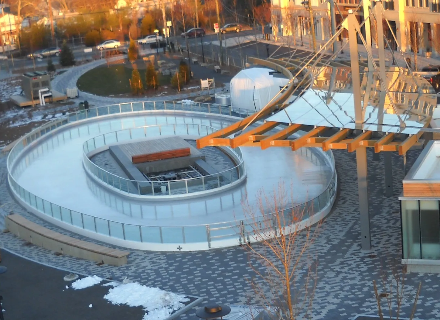 An aerial view of the looping Rinx ice trail through the Wyandanch Plaza grounds at sunrise. — The Rinx at Wyandanch