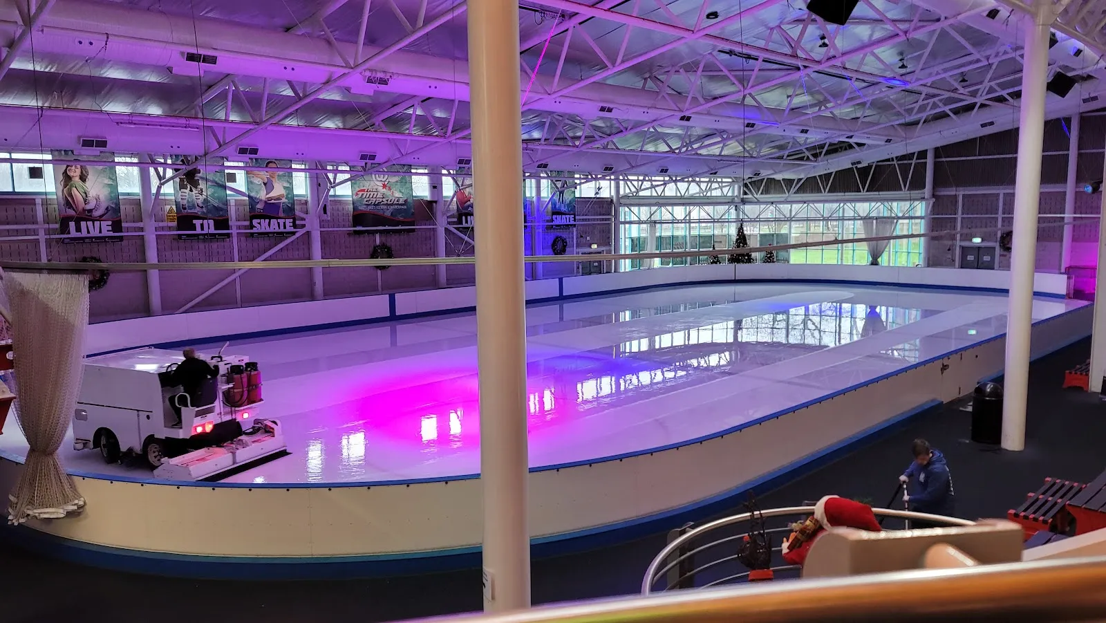 The ice surface and resurfacer inside the Time Capsule rink hall — The Time Capsule Ice Rink