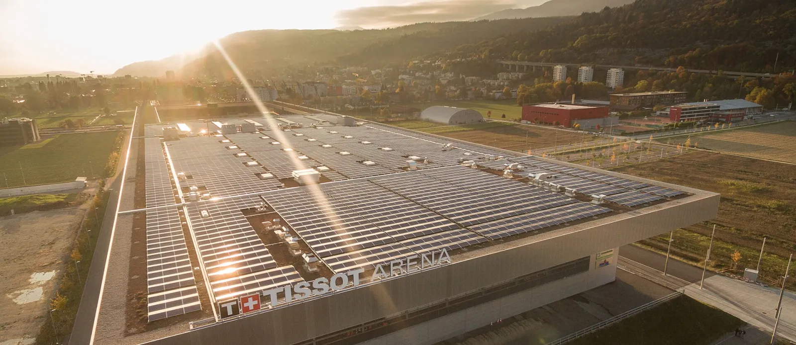 The Tissot Arena seen from above, with the solar plant on its roof — Tissot Arena Eisbahn
