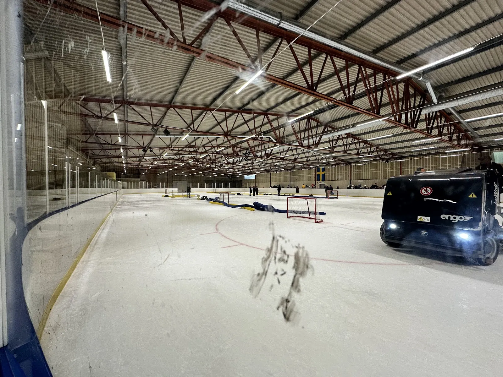 Ice of Tulehallen in Sundbyberg with the ice resurfacer at the far end — Tulehallen
