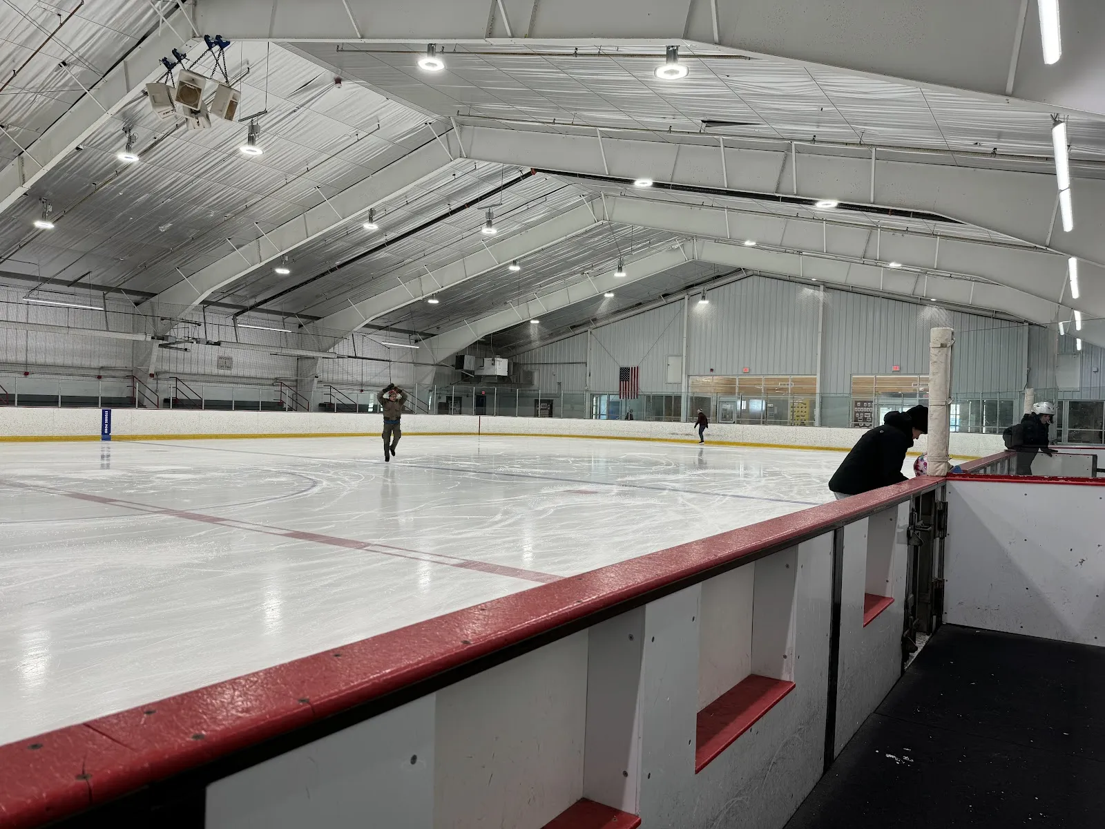 The ice sheet at Union Arena with a lone skater in the distance (photo from the Google Maps listing) — Union Arena