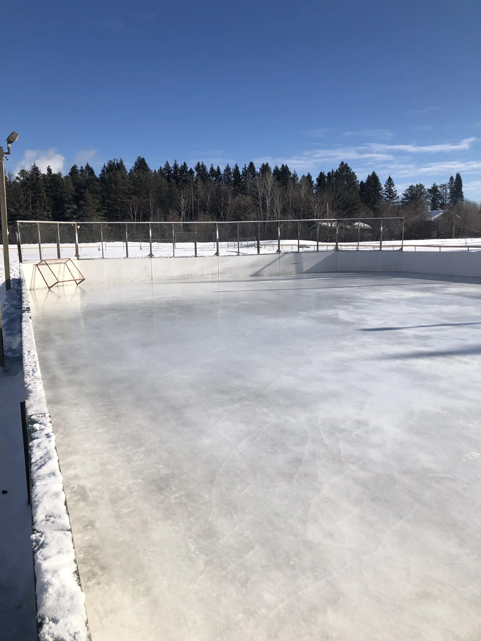The boarded rink at Vickers Heights Community Centre with a clear sheet of ice — Vickers Heights Community Centre Outdoor Rink