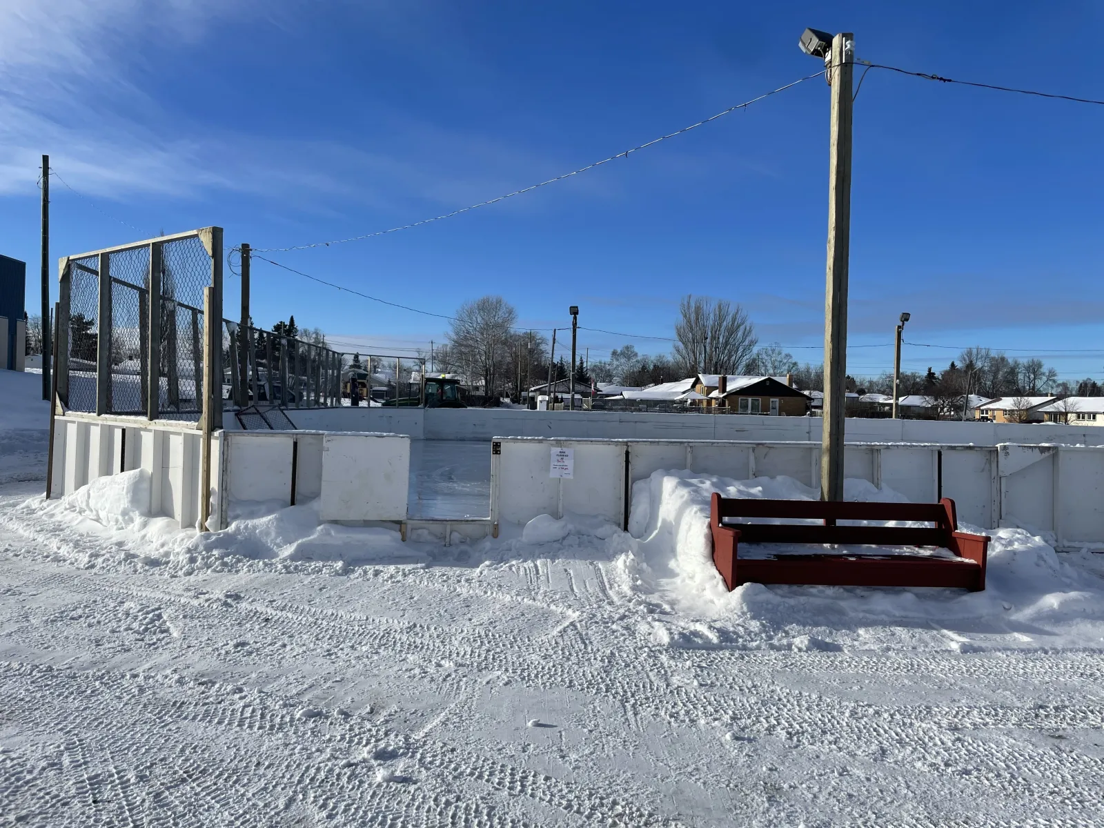 Boards and a bench at the Volunteer Pool Community Centre rink — Volunteer Pool Community Centre Outdoor Rink