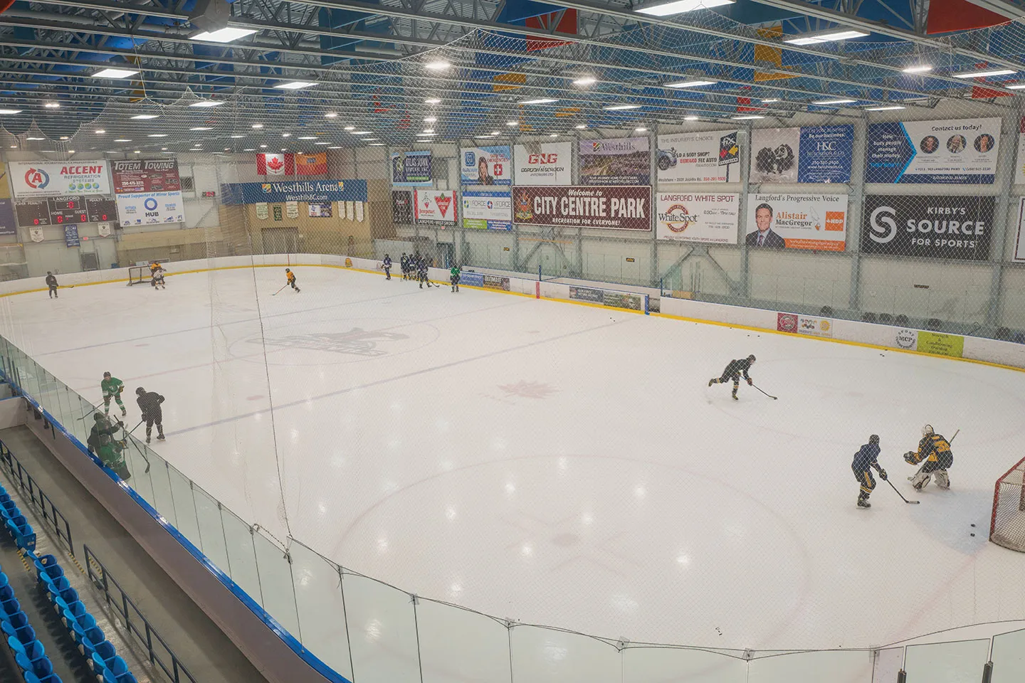 Skaters and goalies in a game on the ice at Westhills Arena, Langford — Westhills Arena