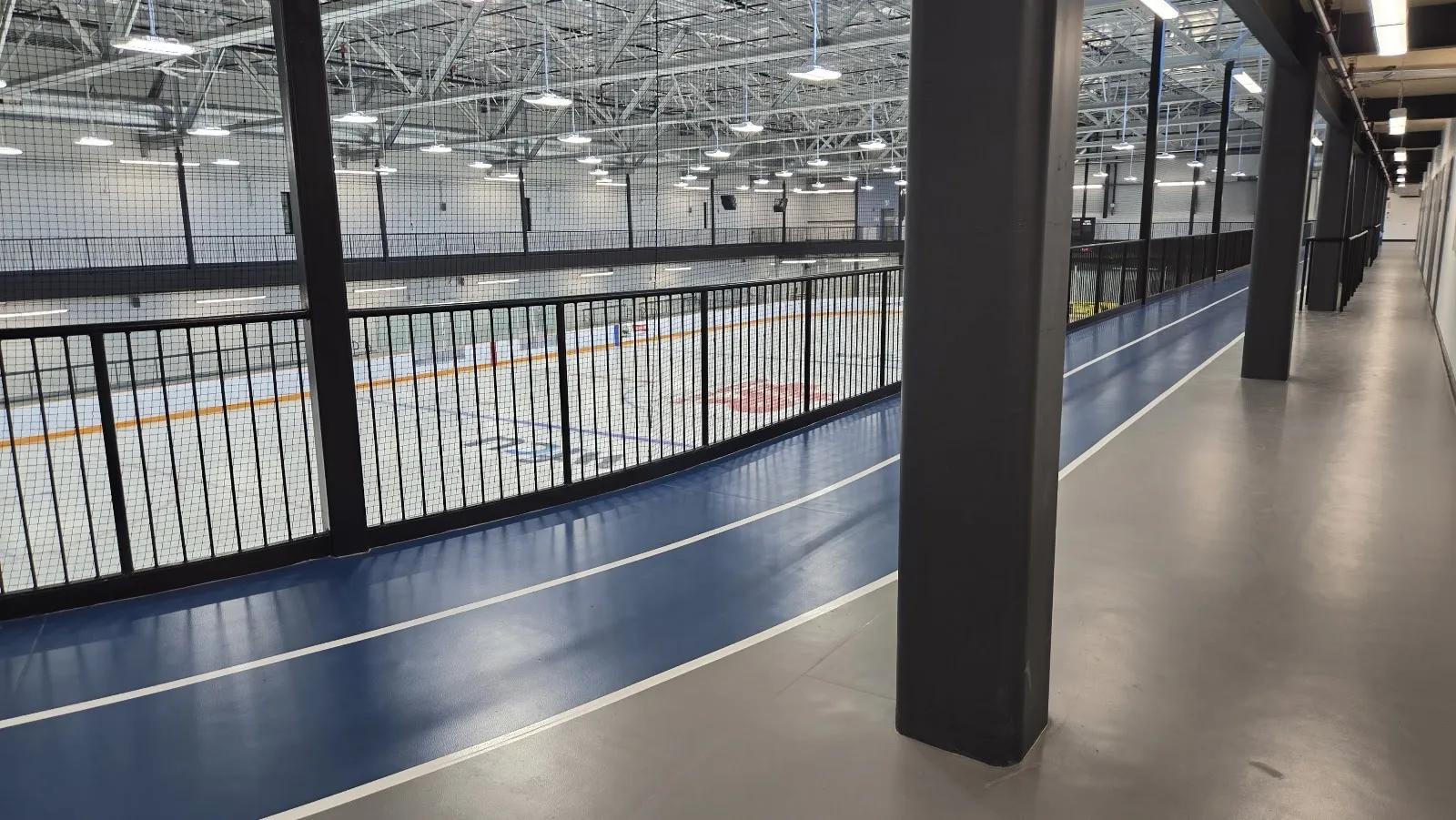 An ice pad seen from the indoor walking track that circles above the rink. — WFCU Place (North Bay)