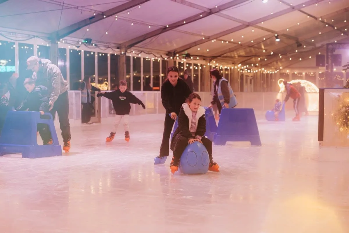 Skaters and skate aids on the covered ice at Willen On Ice (the operator's photo) — Willen On Ice