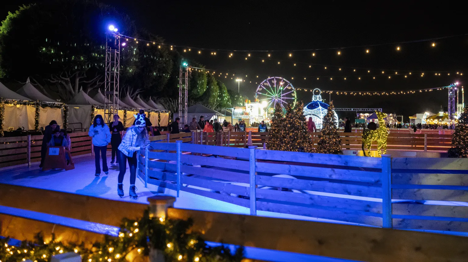 Skaters on the Winter Fest OC rink at night — Winter Fest OC Ice Skating