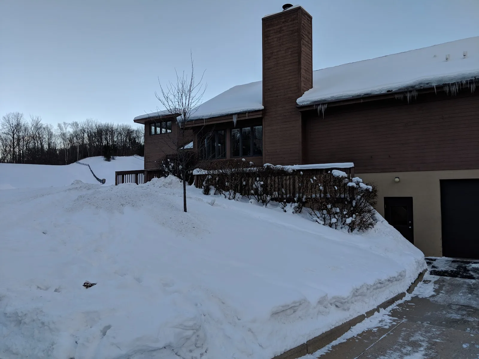 The Petoskey Winter Sports Park lodge in winter, with snowbanks along the entrance — Winter Sports Park
