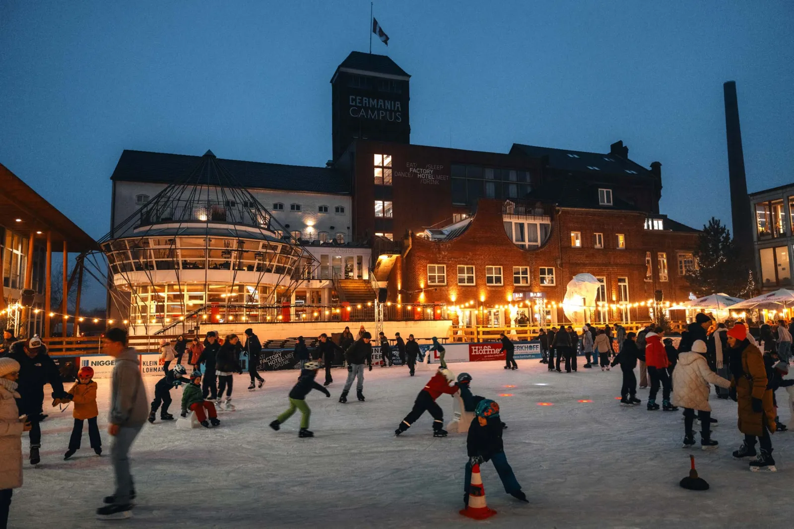 The Winterzeit rink on the Zaubersee with the Germania Campus buildings behind. — Winterzeit Germania Campus