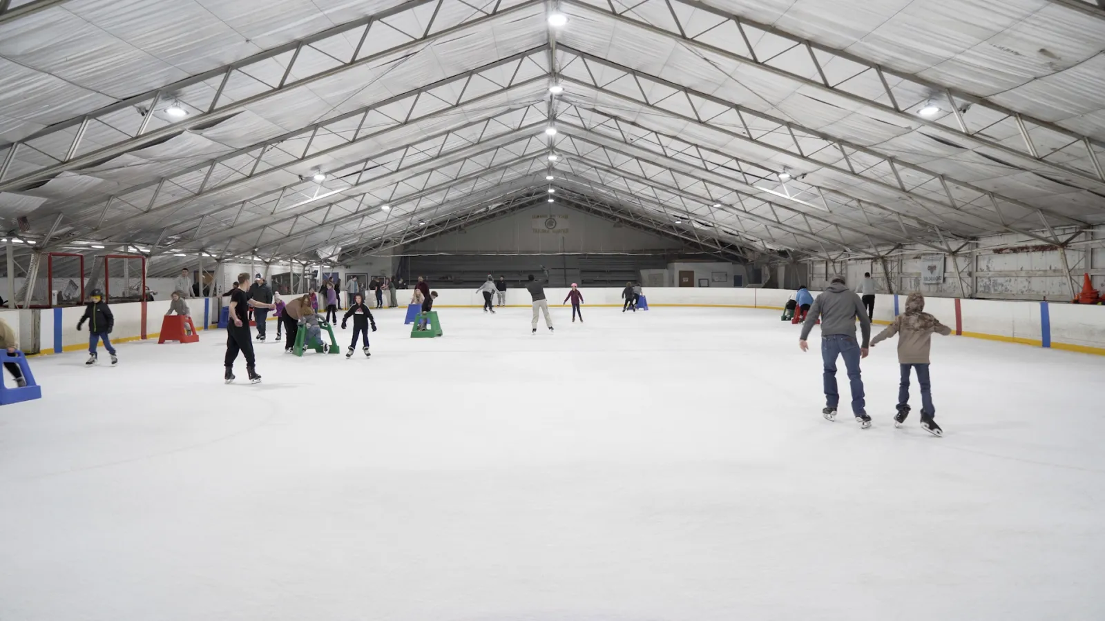 Skaters at a public skate session under the arched roof of the Yakima Ice Rink — Yakima Ice Rink
