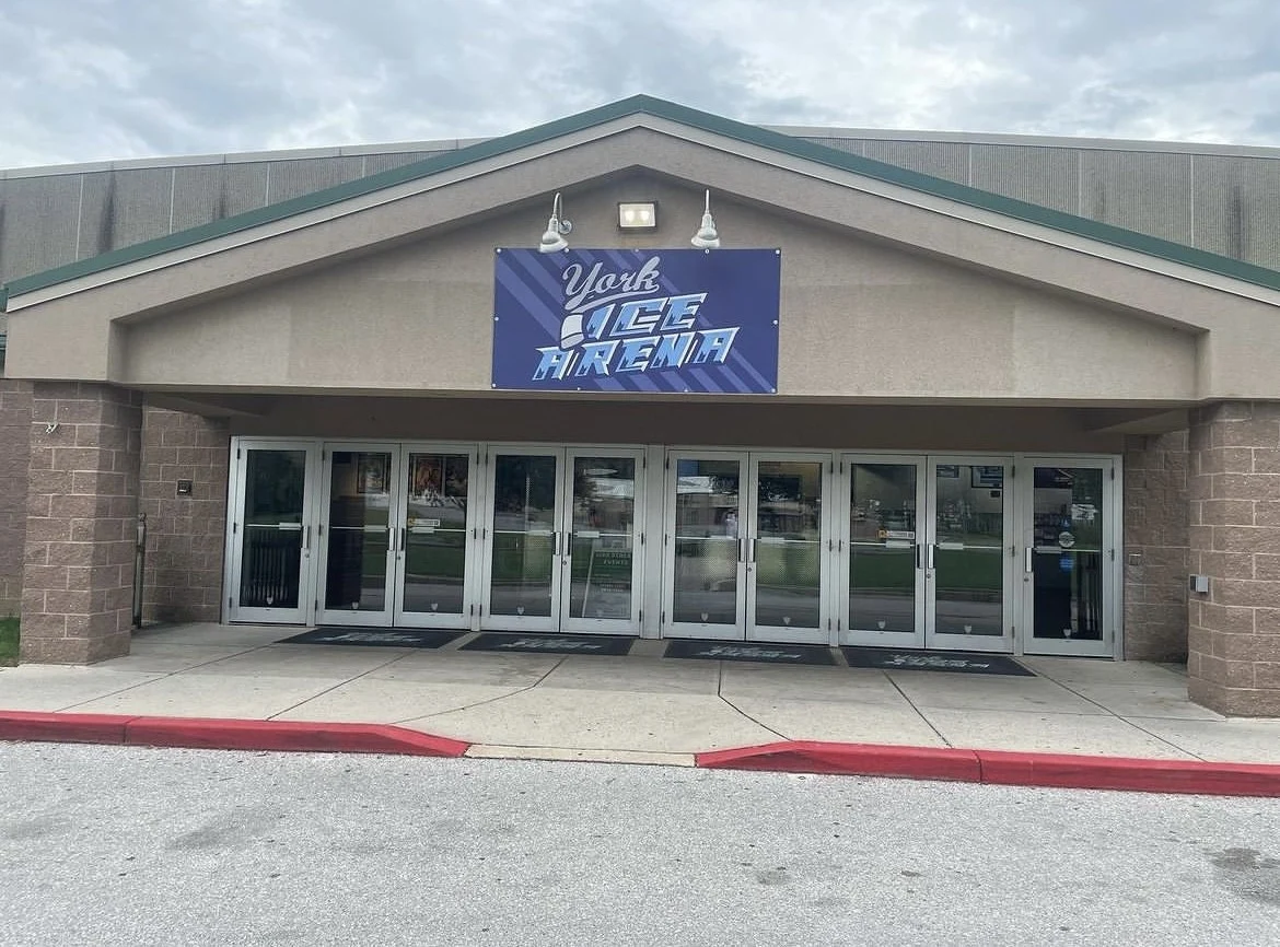 York Ice Arena's main doors beneath its blue arena sign. — York Ice Arena