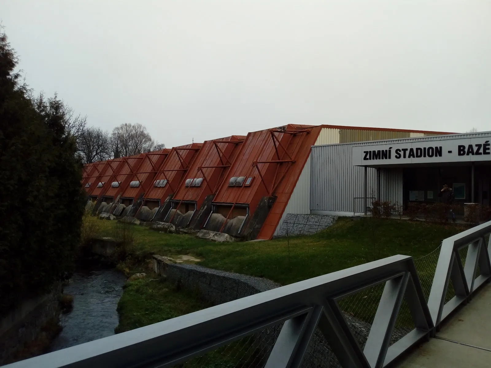 Side of the Zimní stadion in Sušice with its entrance sign — Zimní stadion Sušice