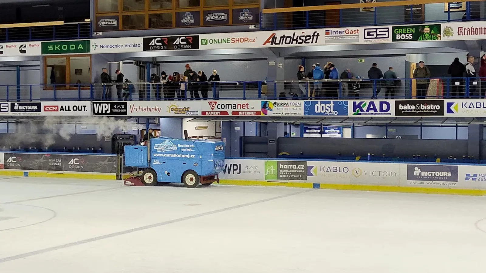 The ice at the Zimní stadion Vrchlabí with the ice resurfacer and the stands beyond — Zimní stadion Vrchlabí (Elektromont aréna)