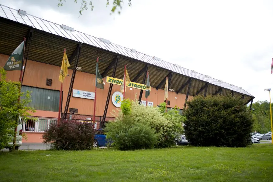 The Vsetín winter stadium building, Na Lapači, from the lawn beside it — Zimní stadion Vsetín