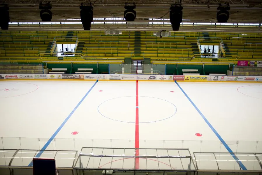 The empty ice sheet of the Vsetín winter stadium, Na Lapači, seen from the stands — Zimní stadion Vsetín