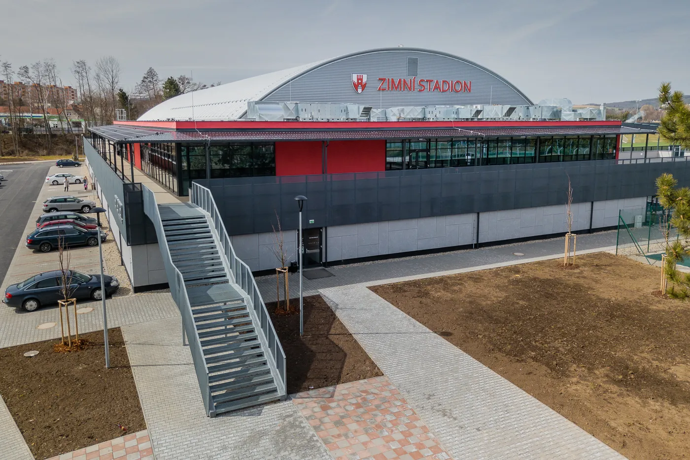The rebuilt winter stadium in Vyškov with its arched roof and entrance stairs — Zimní stadion Vyškov
