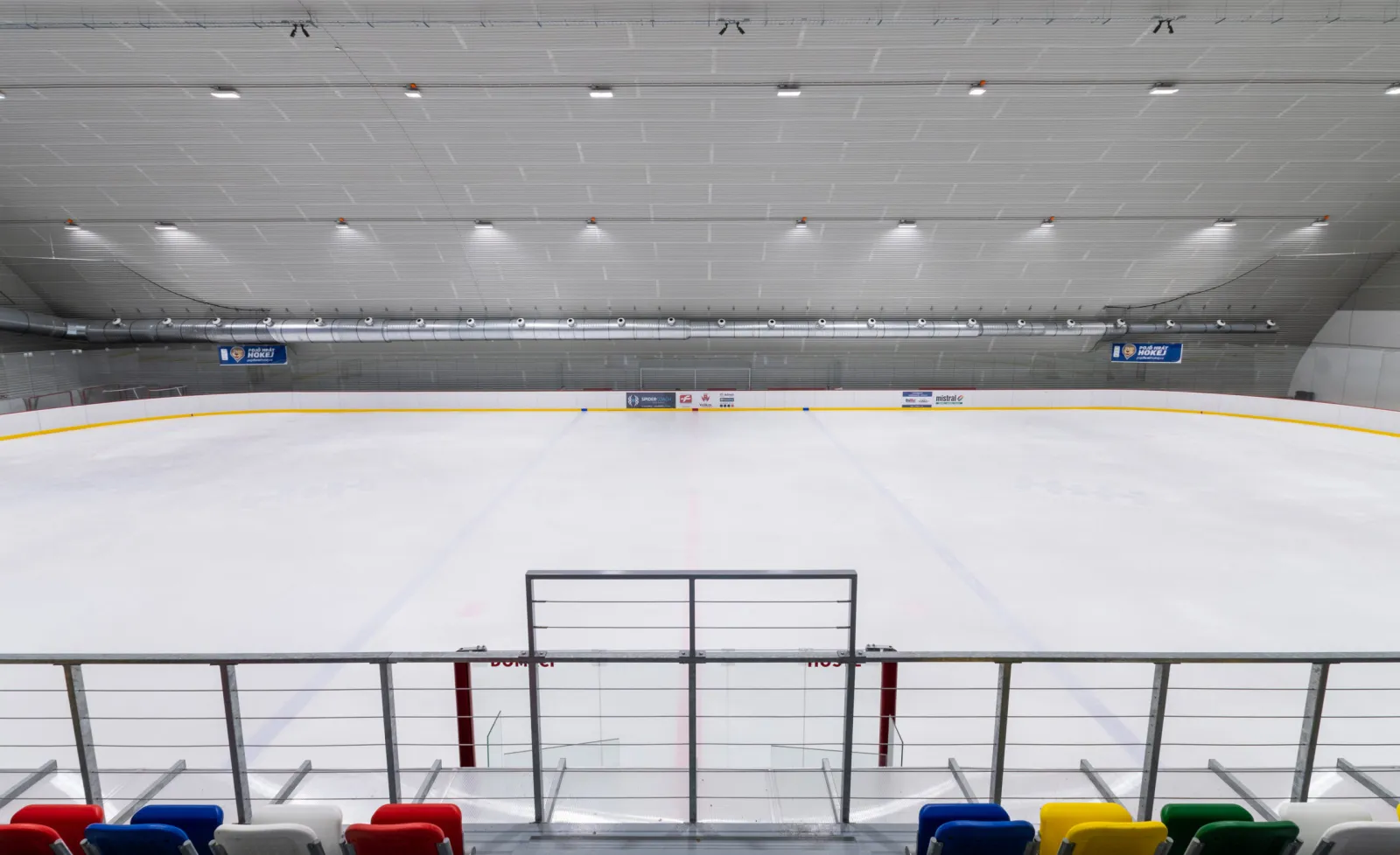 The ice of the rebuilt Vyškov winter stadium seen from the stands — Zimní stadion Vyškov