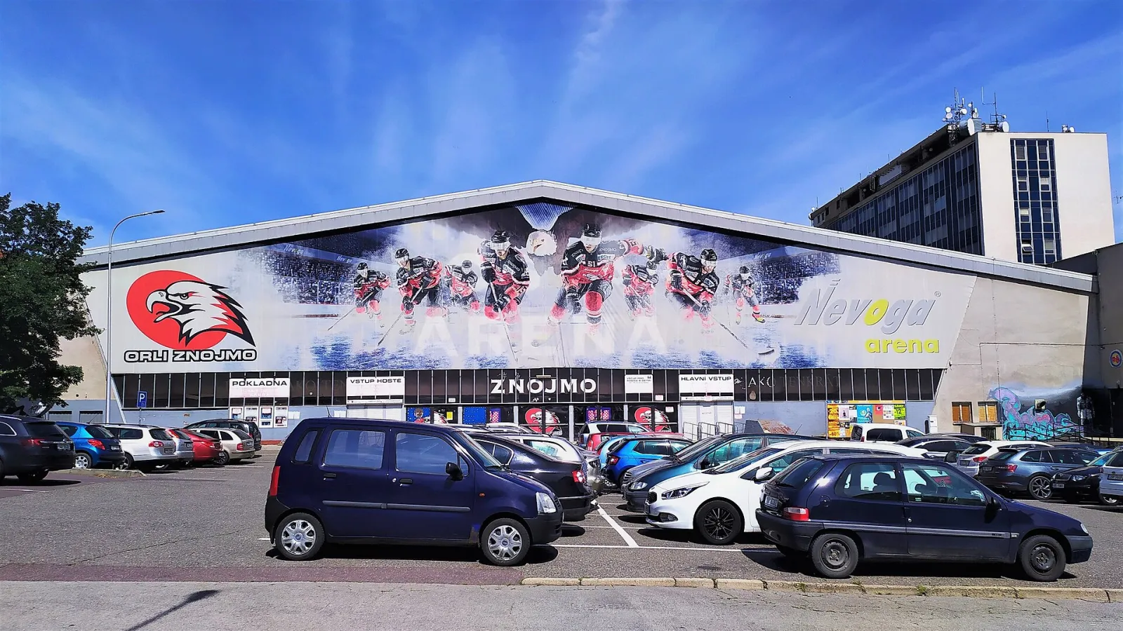The Znojmo winter stadium (Nevoga aréna) on Dvořákova street, with its hockey mural facade — Zimní stadion Znojmo